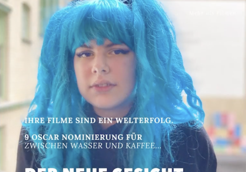 A photo of a young person wearing a blue wig, formatted to look like a magazine.  The text reads 